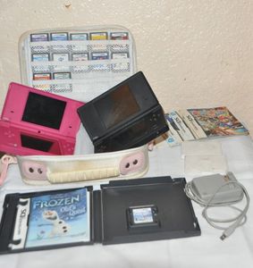lot 10 image: Two Nintendo DSI Game Systems, Carrying Case and Tons of Games, Comes with 1 Charger, Both Games worked Last time they were used.