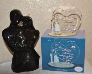 lot 26 image: Black Ceramic Statute Mom, Dad and Baby and Blown Glass Dcor Piece