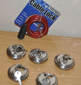 lot 85 image: Five Disc Locks with each with Two Keys and a Cable Lock
