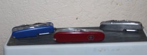 lot 244 image: Three Swiss Army Knives
