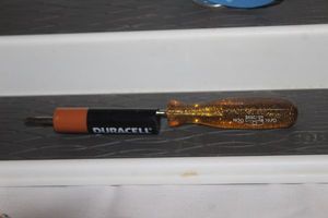 lot 13 image: Vintage Duracell Screwdriver, Snap On 50th Year Anniversary Screwdriver