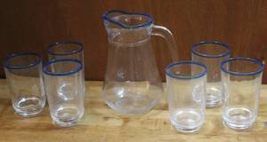 lot 233 image: Pitcher and six glasses all glass with the blue rim
