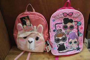 lot 201 image: Lol backpack and a pink llama backpack