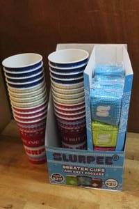 lot 192 image: Slurpee cups and sweaters for the cups