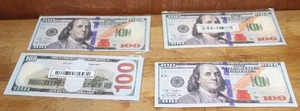 lot 168 image: 4- $100 bill wallets