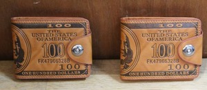 lot 167 image: 2-$100 bill wallets