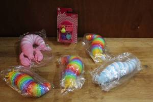 lot 165 image: Mixed Lot of toys fidget toys and a Barbie toy all unopened