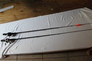 lot 282 image: Two fishing poles zebcos one a 202 one is a 33