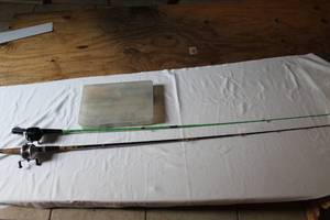 lot 280 image: Fishing poles a zebco 202 and zebco and box with some tackle in it