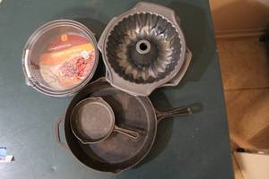 lot 278 image: 2 cast iron pan and set of 3 spring form cake pans unopened and 3 Non-Stick Fluted Tube Pan,
