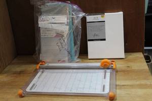 lot 94 image: Craft lot cutting board and embossing machine platforms and shims and 8x10 canvas