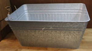 lot 104 image: Metal ice bucket with bottle opener about 10 inches tall and about 22 inches wide
