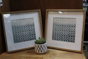 lot 105 image: ceramic planter containing a succulent plant. And   2 decorative wall art piece featuring a geometric pattern with a blue and white color scheme