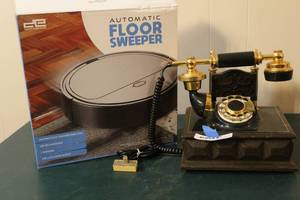 lot 250 image: Western Electric Design Line rotary dial telephone and  Automatic floor sweeper