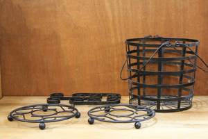 lot 42 image: 2  BLACK ROUND TRIVETS and a black metal basket and more see pictures