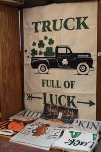 lot 39 image: Mixed Lot of pillow covers and truck full of luck banner