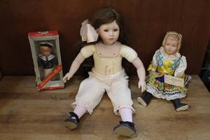 lot 34 image: Vintage doll lot one signed and Vintage Sailor Celluloid Mechanical in original box and more see pictures