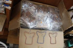 lot 23 image: Large lot of hand made angel decor made in India 3 to each pack theres many packs in this box packed full