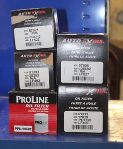 lot 29 image: Five Oil Filters, (4) are Auto Extra and 1 Proline, These fits Various Volkswagon, Audi, 1999 Volvo Volvo 1800, DL 84, 544, 149, Landrover