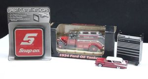 lot 98 image: Snap-On trailer hitch cover, miniature tool box, die cast car and Hot Wheel