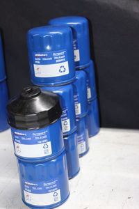 lot 111 image: NEW AC Delco oil filters plus filter wrench attachment