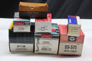 lot 167 image: Assorted auto parts including solenoid, fuel filter and more as shown
