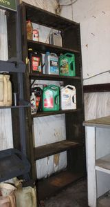 lot 173 image: Metal storage shelf plus contents including automotive oils