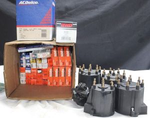 lot 187 image: AC Delco, Autolite spark plugs and rotor caps
