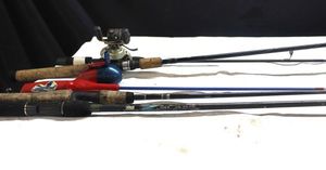lot 199 image: Assorted fishing rods and reels as shown