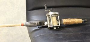 lot 208 image: True blue fishing reel and rod