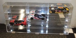 lot 215 image: NASCAR Die cast cars and display