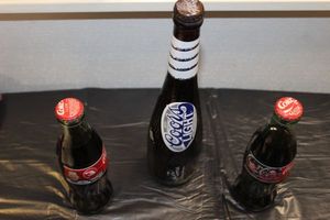 lot 229 image: Collectible Coca-Cola and Coors Light bottles unpoened NOT FOR CONSUMPTION