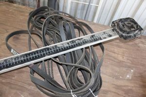lot 243 image: Assorted automotive fan belts and fan belt tension gauge