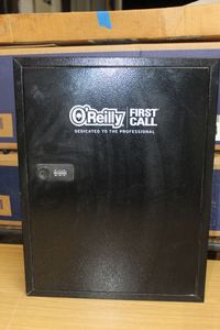 lot 295 image: OReilly combination locking storage cabinet