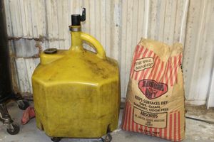 lot 307 image: Absorb-N-Dry spill absorbent and fluid container