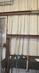 lot 334 image: Four Fishing Poles with Reels