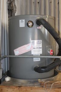 lot 362 image: Rheerm Hot Water Tank, 19.9 Gal. DOM 2022, currently in use. Only Available for pick up August 31stBring tools and help , for removal