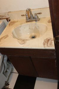 lot 377 image: Bathroom sink and Cabinet, bring tools and help, August 31st pick up only