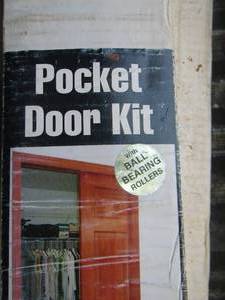 lot 92 image: pocket door kit NIB