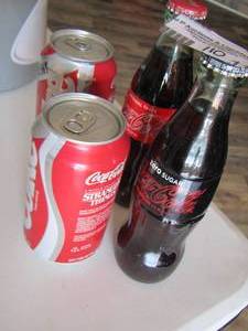 lot 110 image: COLLECTABLE Coke cans and bottles - STRANGER THINGS