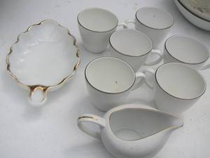 lot 146 image: China cups and butter dish plus a milk glass nut trays
