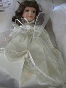 lot 3 image: Vintage baby doll porcelain face wearing a white dress beautiful