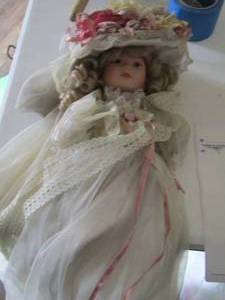 lot 4 image: Vintage gardening baby doll with dress and hat