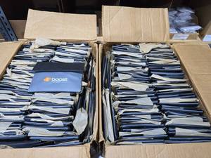 lot 34 image: 2 Boxes Full of Boost Mobile Pen & Notepad Sets.  Approx 150 Sets