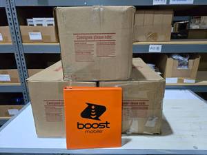 lot 37 image: 3 Boxes of Boost Mobile 3-Ring Binders.  Approx 78 Binders Total