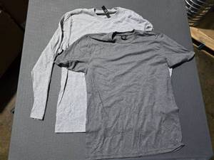 lot 206 image: WOW  6 Boxes of District DT5000, DM6200 & DM130 Long Sleeve & Short Sleeve Heather Grey Shirts,  SEE DESCRIPTION FOR SIZES AND QUANTITIES  BID IS TIMES THE QUANTITY SO YOU ARE BIDDING PER BOX