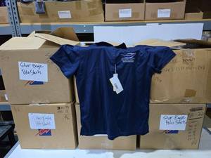 lot 190 image: 6 Boxes of Core365 Navy Polos.  Approx 300 Shirts Tital.  Shirts have embroidered logos.