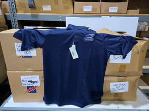 lot 191 image: 6 Boxes of Core365 Navy Polos.  Approx 300 Shirts Tital.  Shirts have embroidered logos.