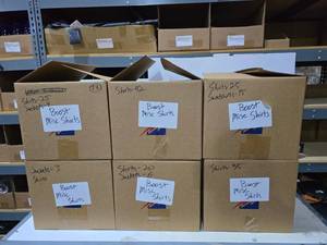 lot 197 image: 4 Boxes Full of Misc Boost Mobile Shirts, Polos & Jackets.  Approx 200 Total