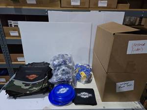 lot 283 image: Large Lot of Over 500 Pieces of Misc Westmor Gear.  Includes Drawstring Backpacks, Frisbees, Mouse Pads, Stress Balls & Card Holders